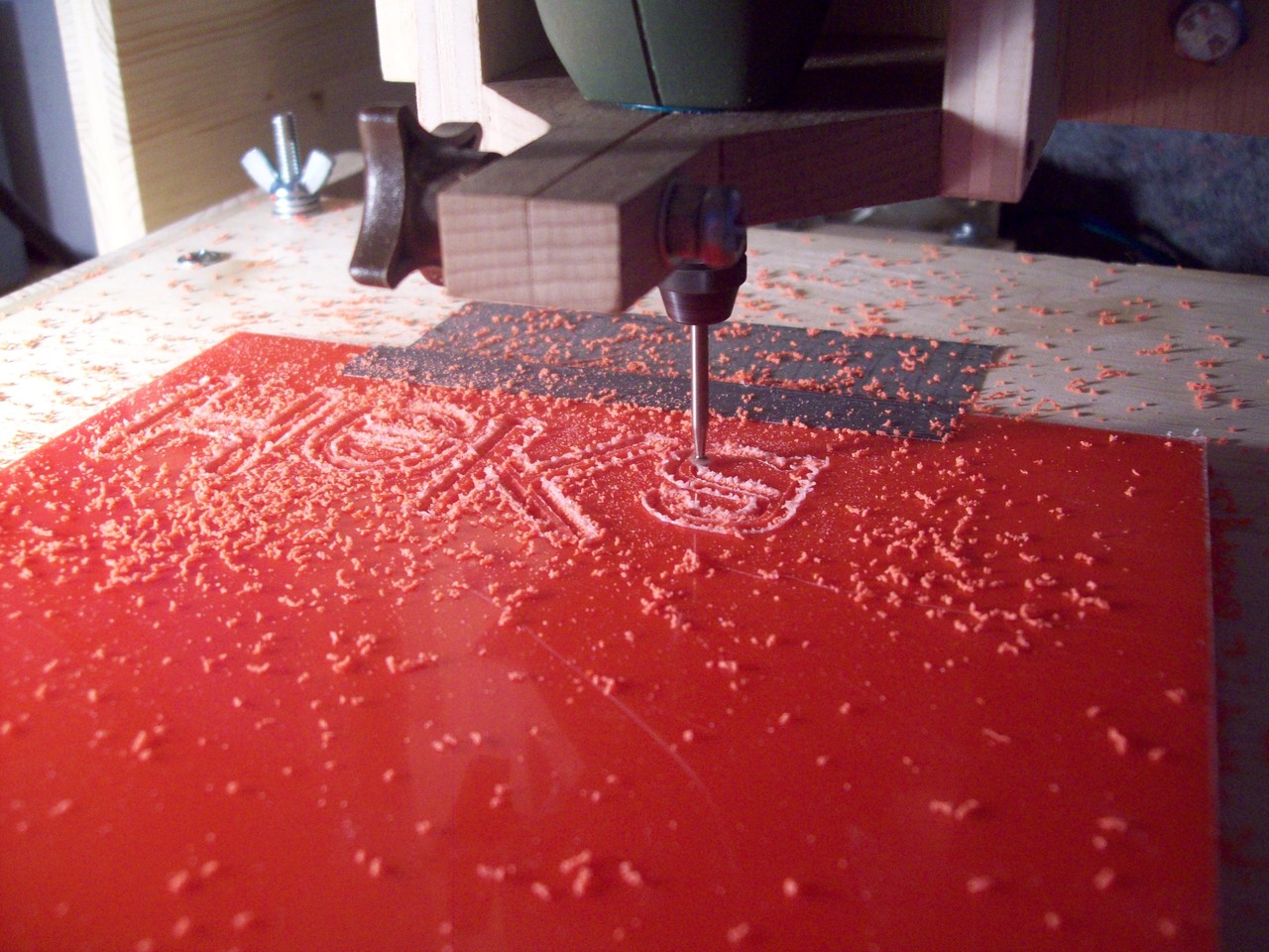 Engraving Plexiglas on the wooden CNC machine